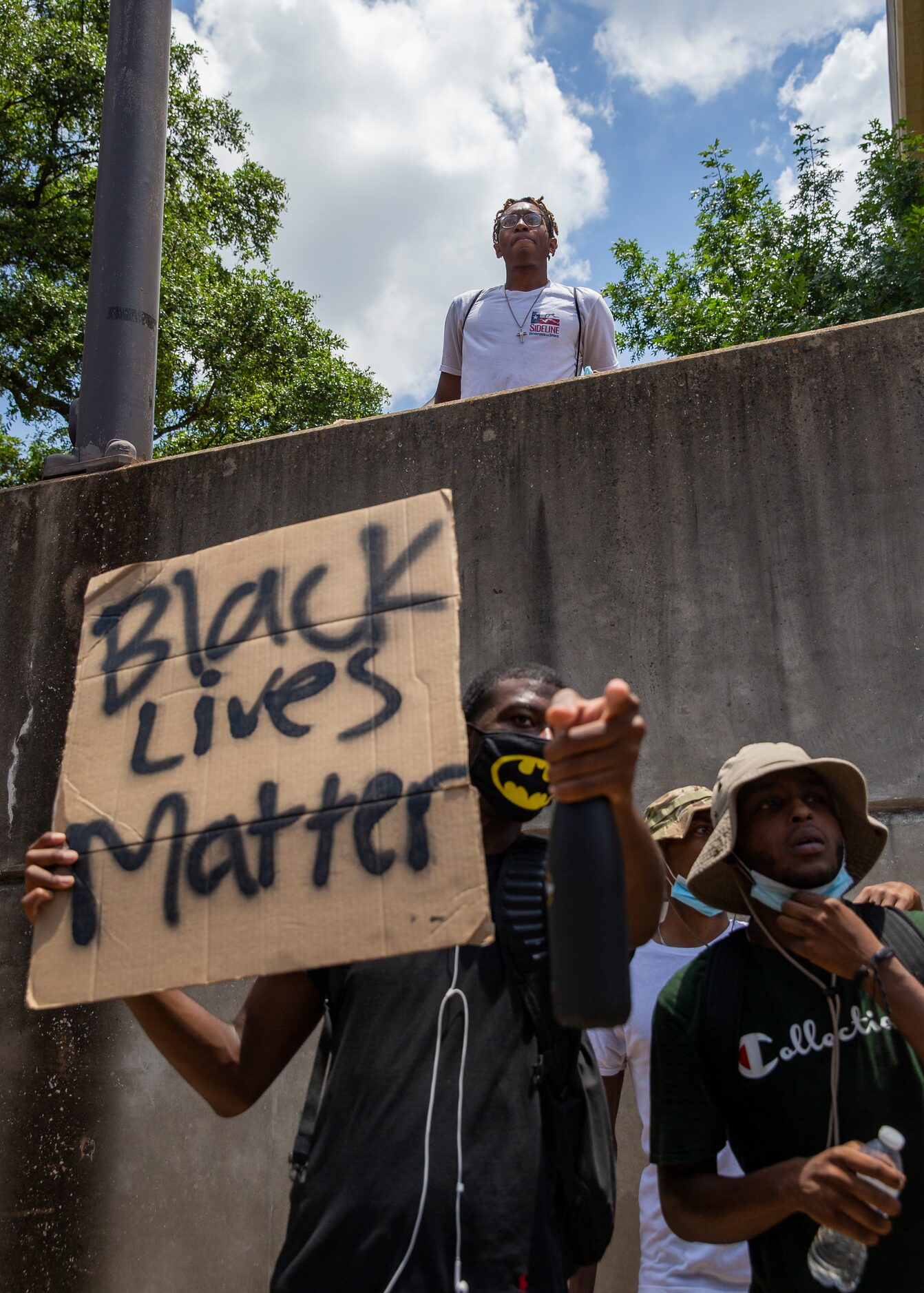 Protestors against police brutality march down S Cooper St as they participate in the UTA...