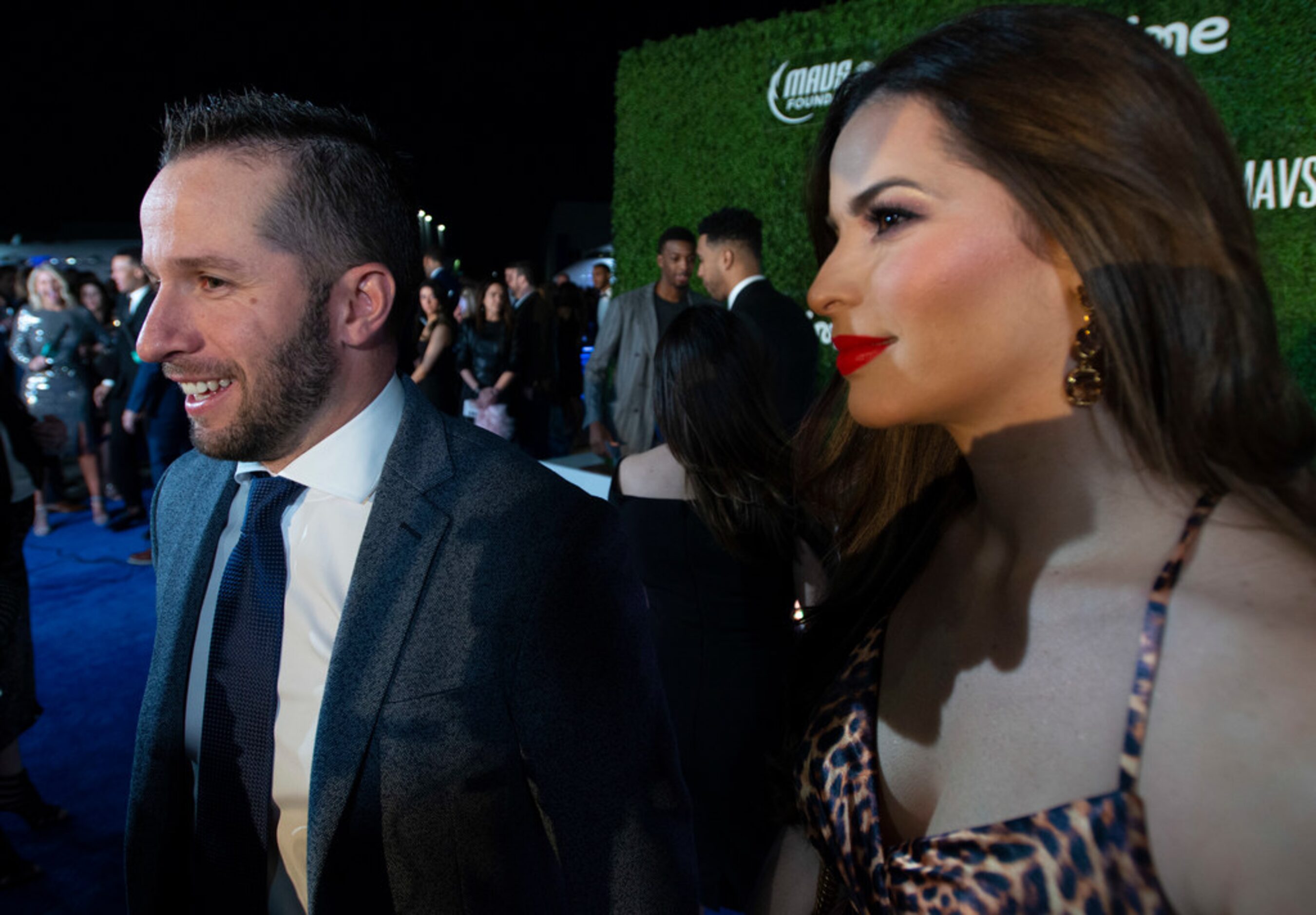 Mavs player J.J. Barea and companion pause on the blue carpet prior to the Mavs Ball Million...