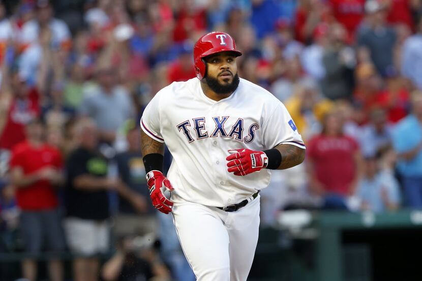 Texas Rangers designated hitter Prince Fielder (84) watches his two-run homer fly to the...