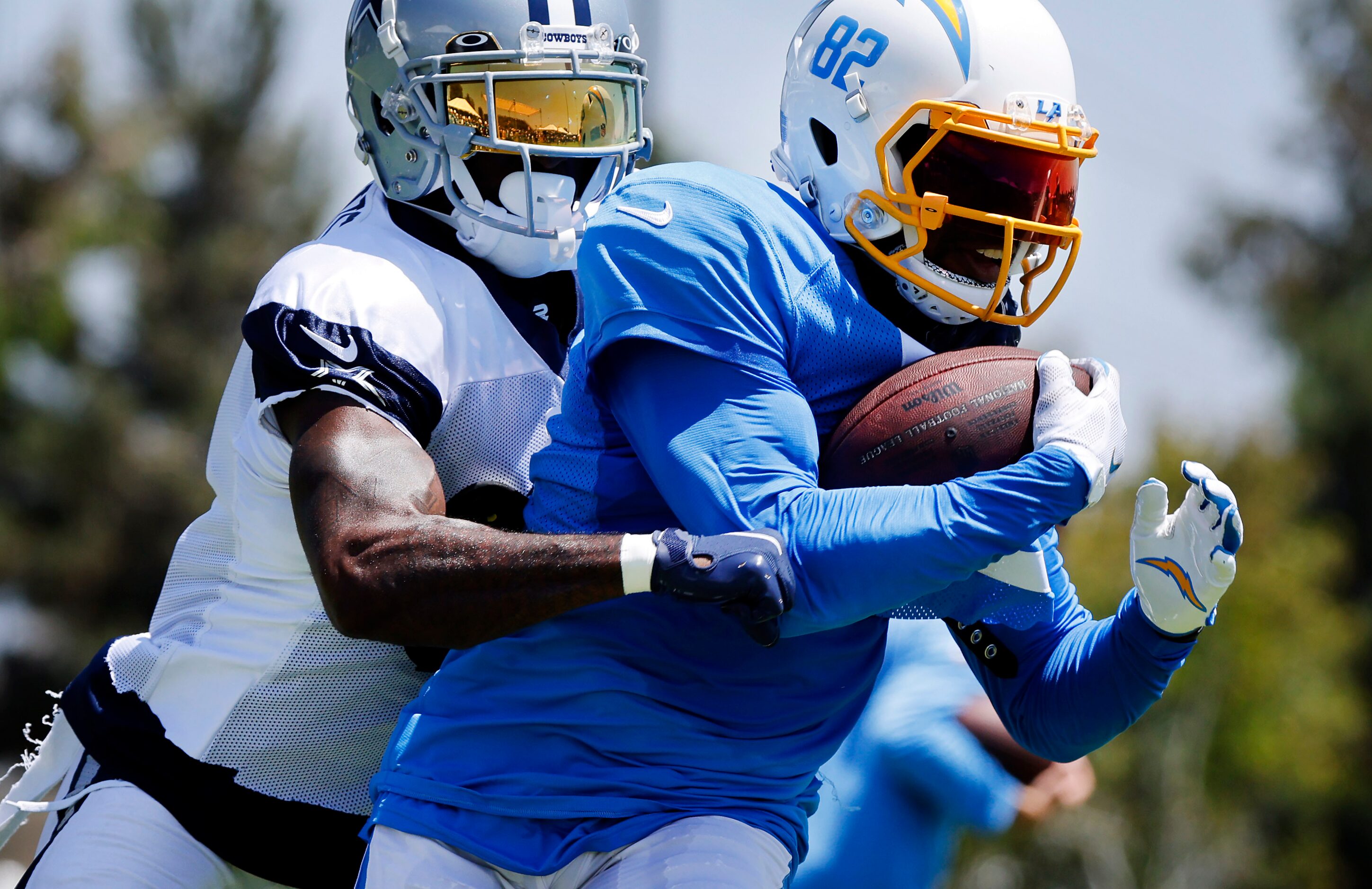 Dallas Cowboys cornerback Jourdan Lewis (2) tries to force a fumble from Los Angeles...