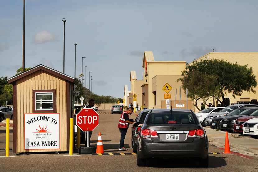 A security guard checks cars at the entrance to Casa Padre, a former Walmart which is now a...