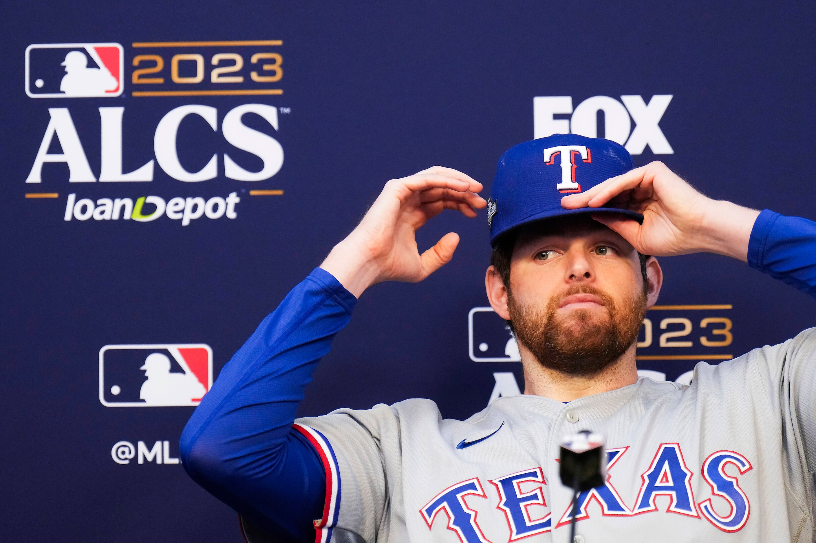 Texas Rangers starting pitcher Jordan Montgomery addresses reporters prior to a workout in...