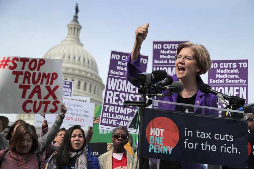 Sen. Elizabeth Warren spoke out against the Republican tax plan outside the U.S. Capitol in...