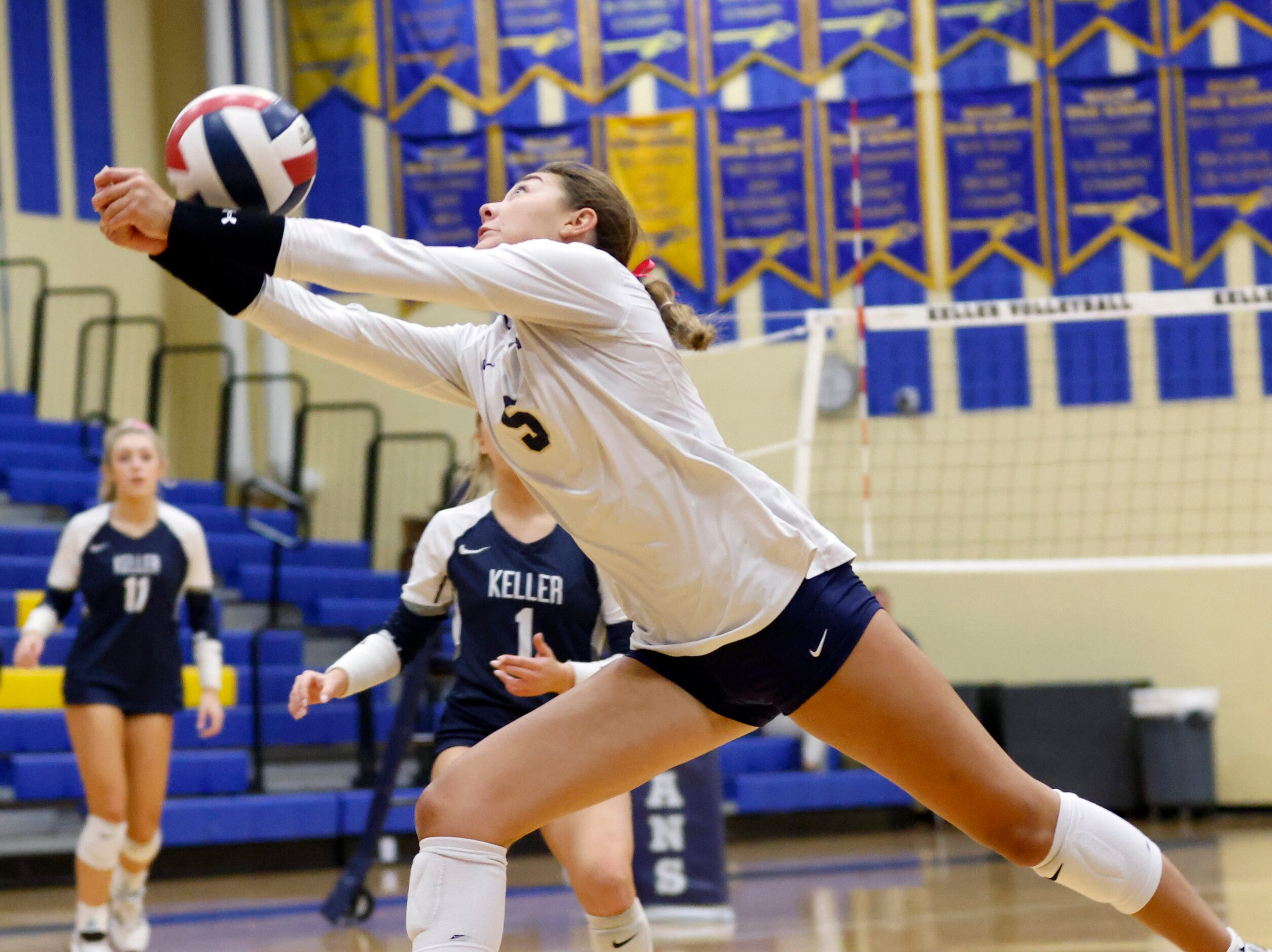 Keller High’s Kea Whillock (5) makes a valiant return against Eaton High during the second...