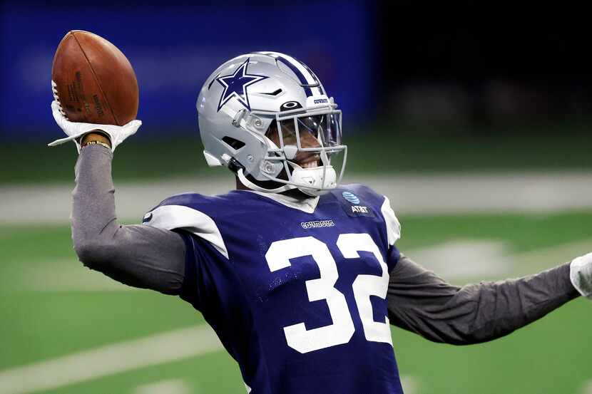 Dallas Cowboys safety Jayron Kearse (32) tosses the ball around during Training Camp...