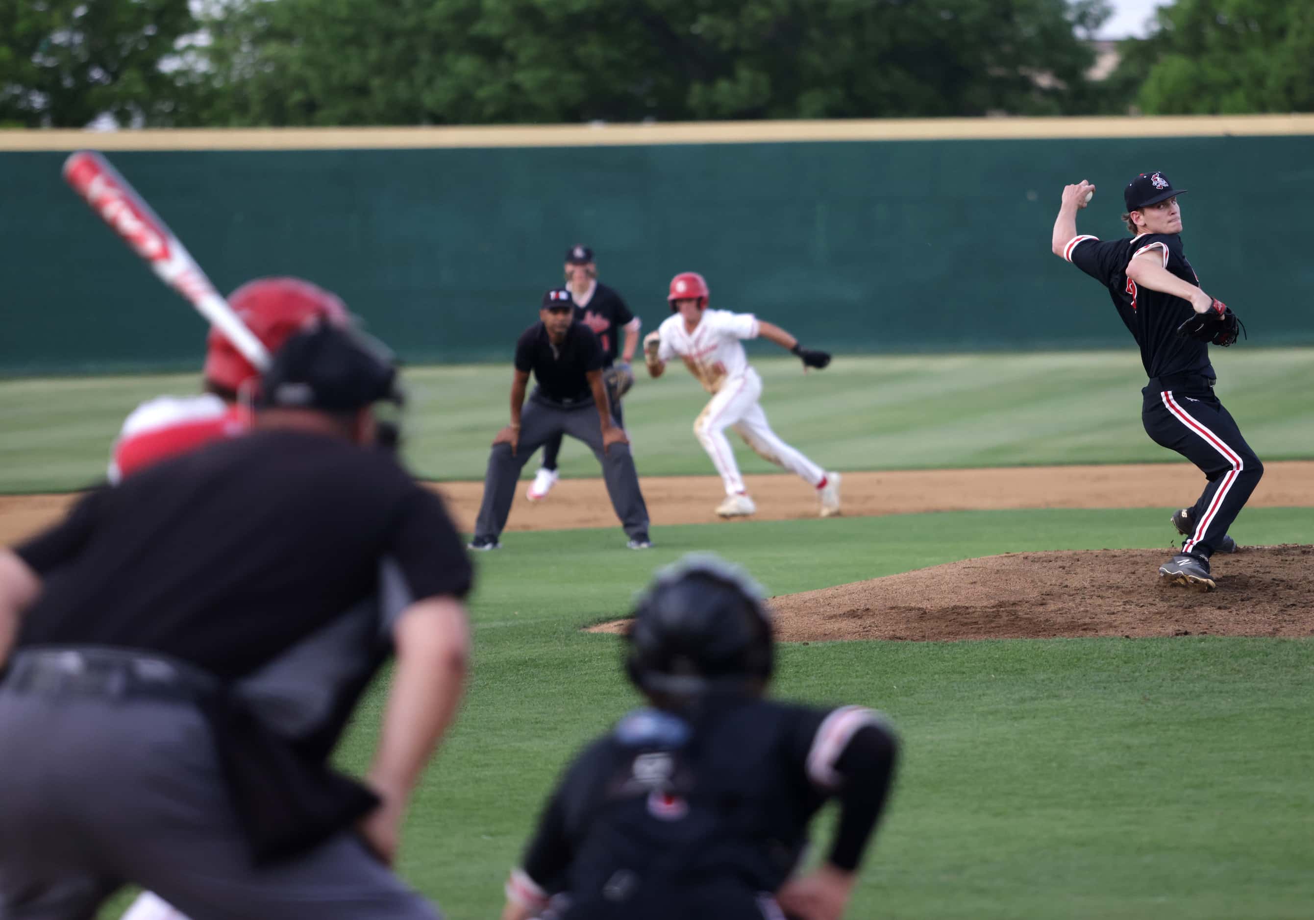Argyle High School player Alex D'Angelo pitches during a baseball game against Grapevine...