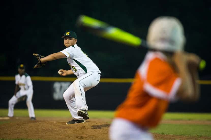 Madison pitcher Andreas Diaz delivers a pitch during a high school baseball game against...