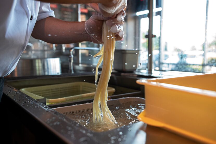 After the noodles are boiled, they're washed in cool water to remove the starch.