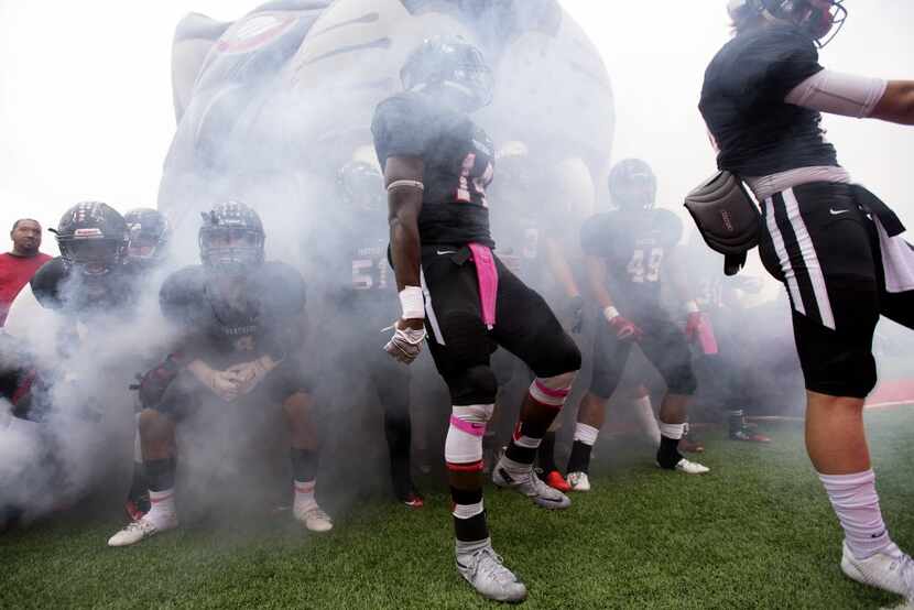 Colleyville Heritage prepares to take the field before a high school football game against...