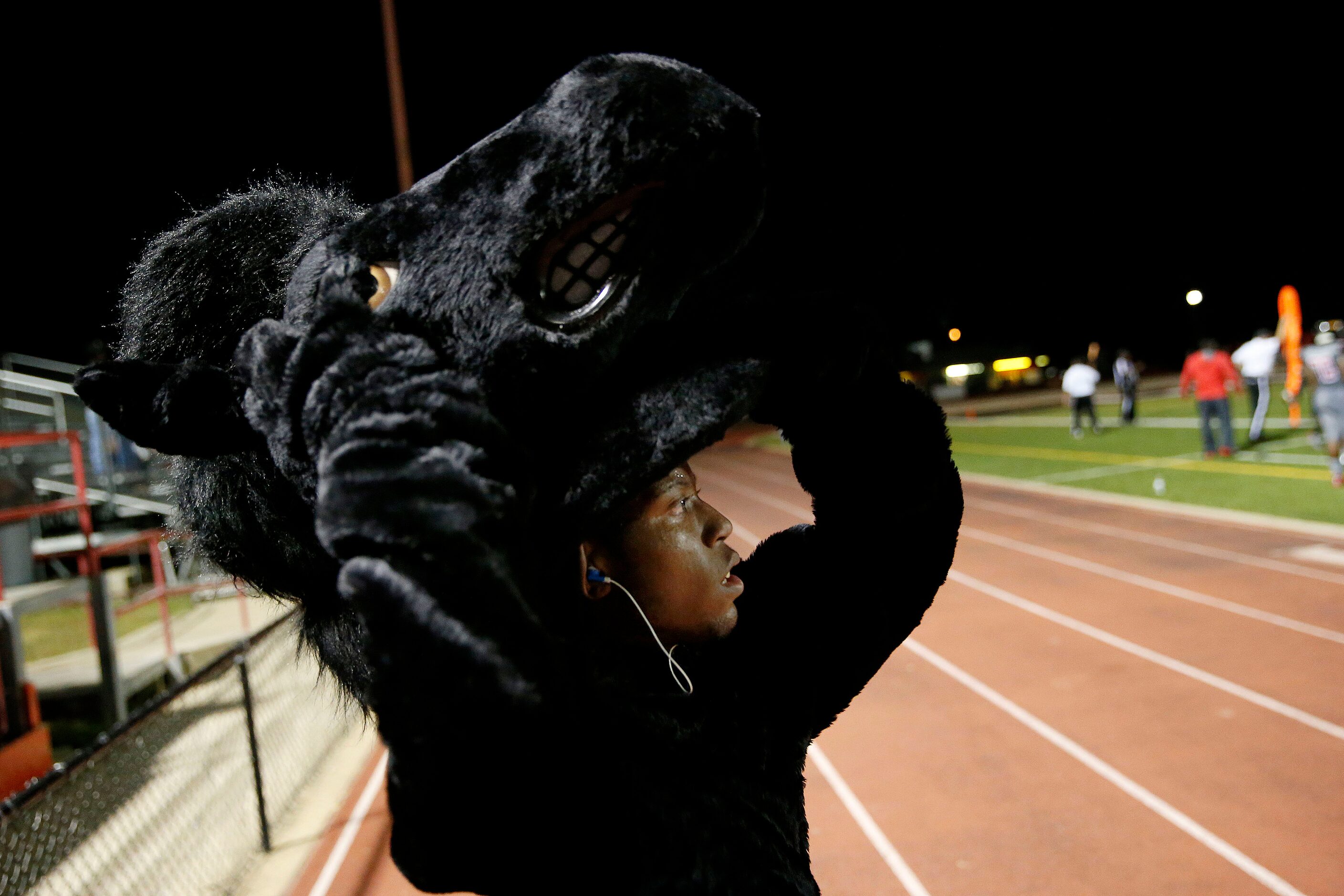 AAA Prime U students Ronan Johnson, 16, who plays school mascot "Stanley the Stallion" puts...