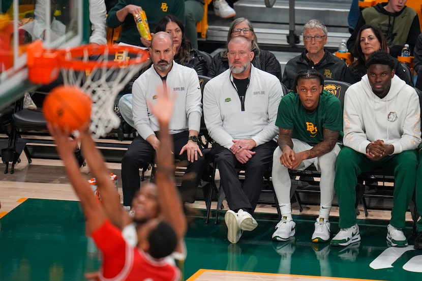 Bill Gates, second from top right, sits with his girlfriend, Paula Hurd, behind the Baylor...