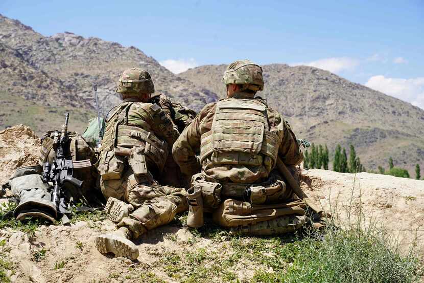 In this June 6, 2019, photo US soldiers look out over hillsides during a visit of the...