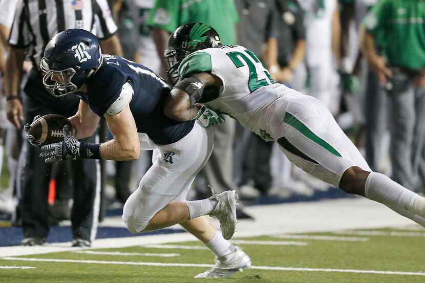 HOUSTON, TX - SEPTEMBER 24: Wide receiver Zach Wright #17 of the Rice Owls is tackled by...