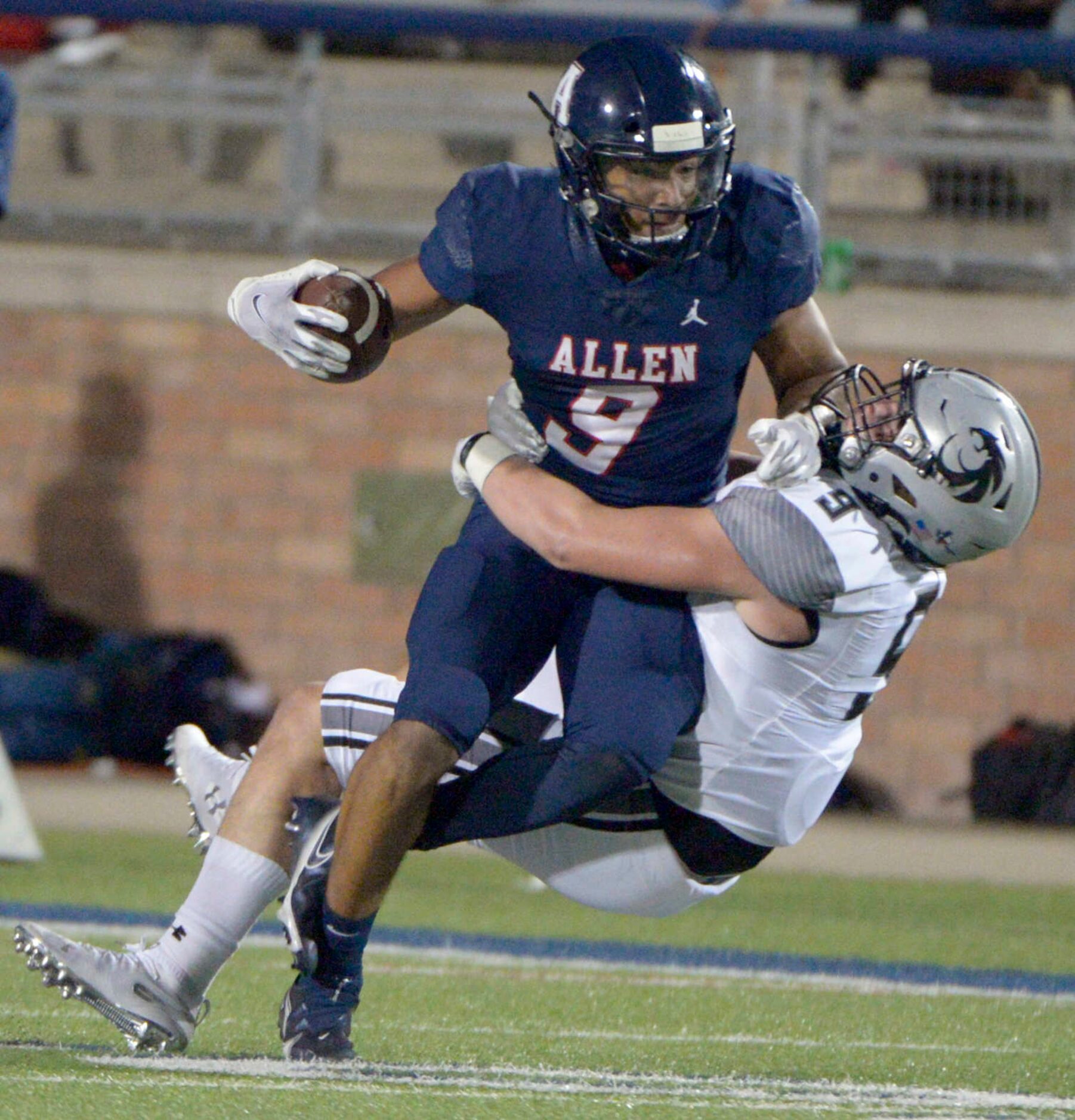 Allen’s Bryson Green (9) tries to run through a tackle attempt by Denton Guyer’s Rowan...