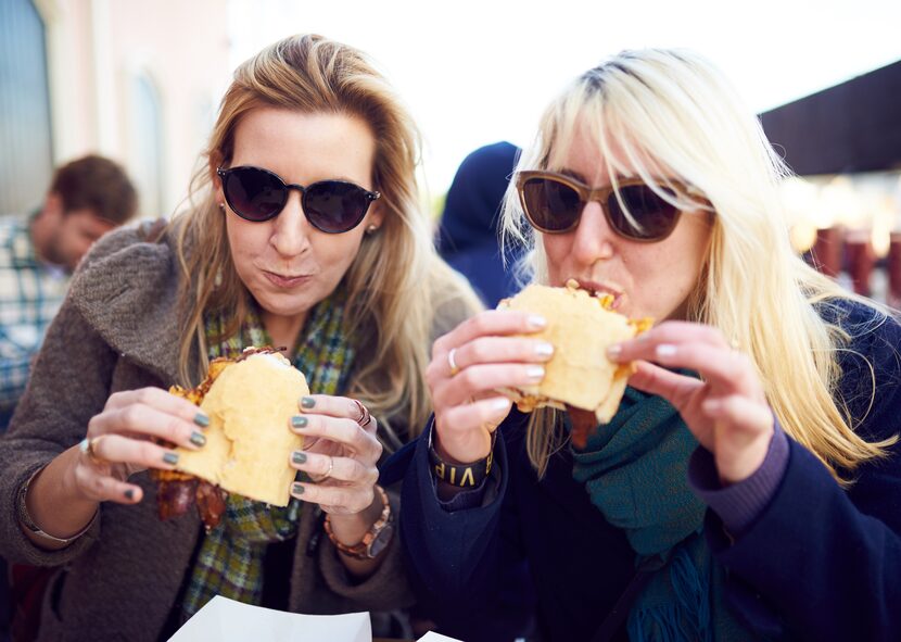 Festival-goers chow down on po-boys at the annual festival.