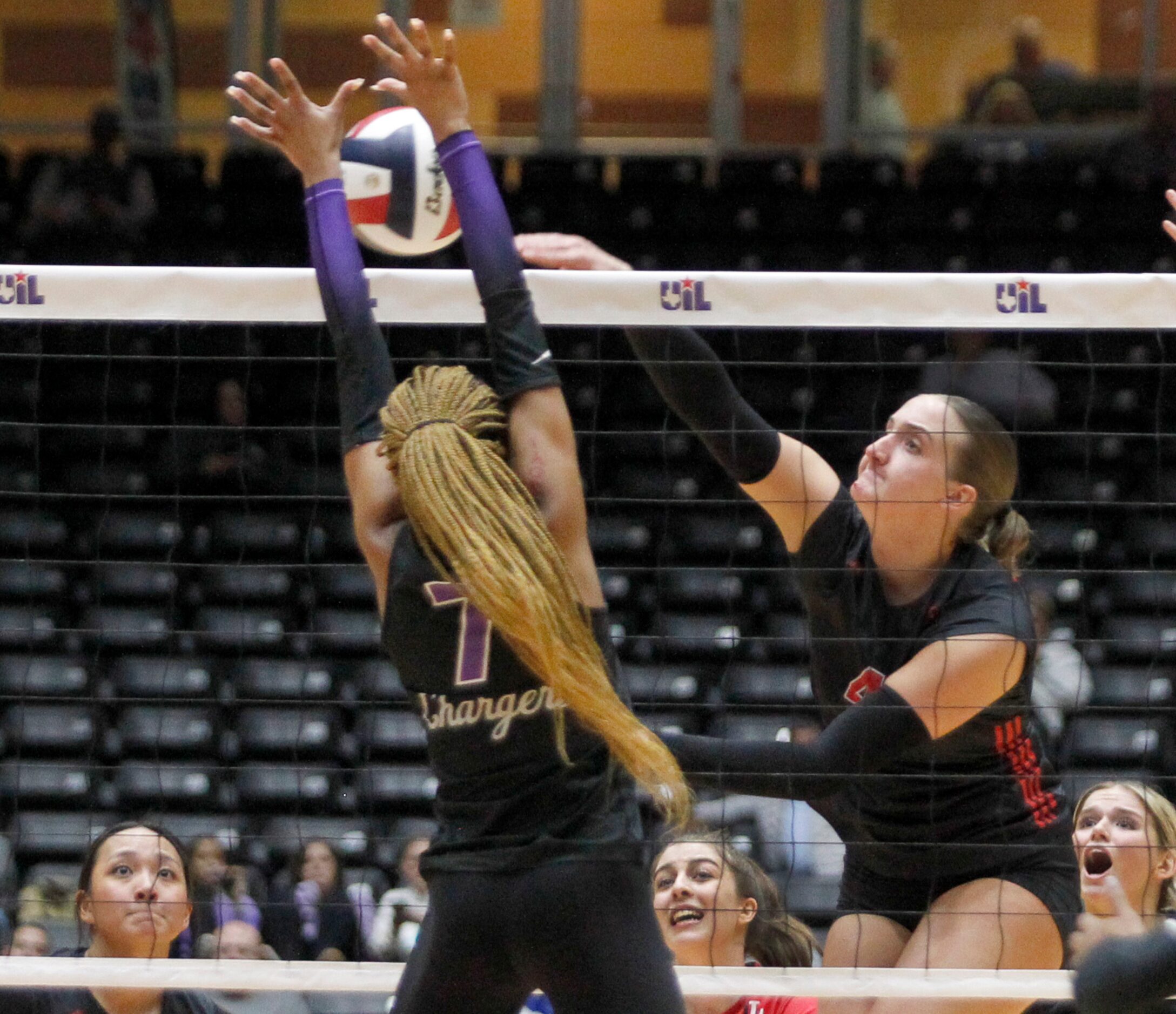 Lucas Lovejoy junior Anna Barr (4), right, powers a shot past the defense of Lamar Fulshear...