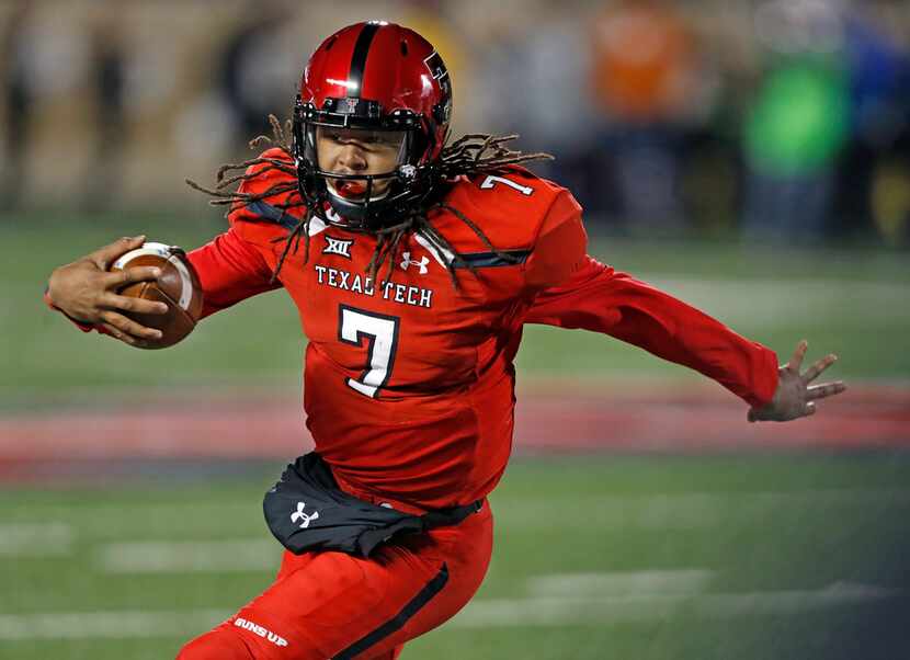 Texas Tech's Jett Duffey runs with the ball during the first half of an NCAA college...