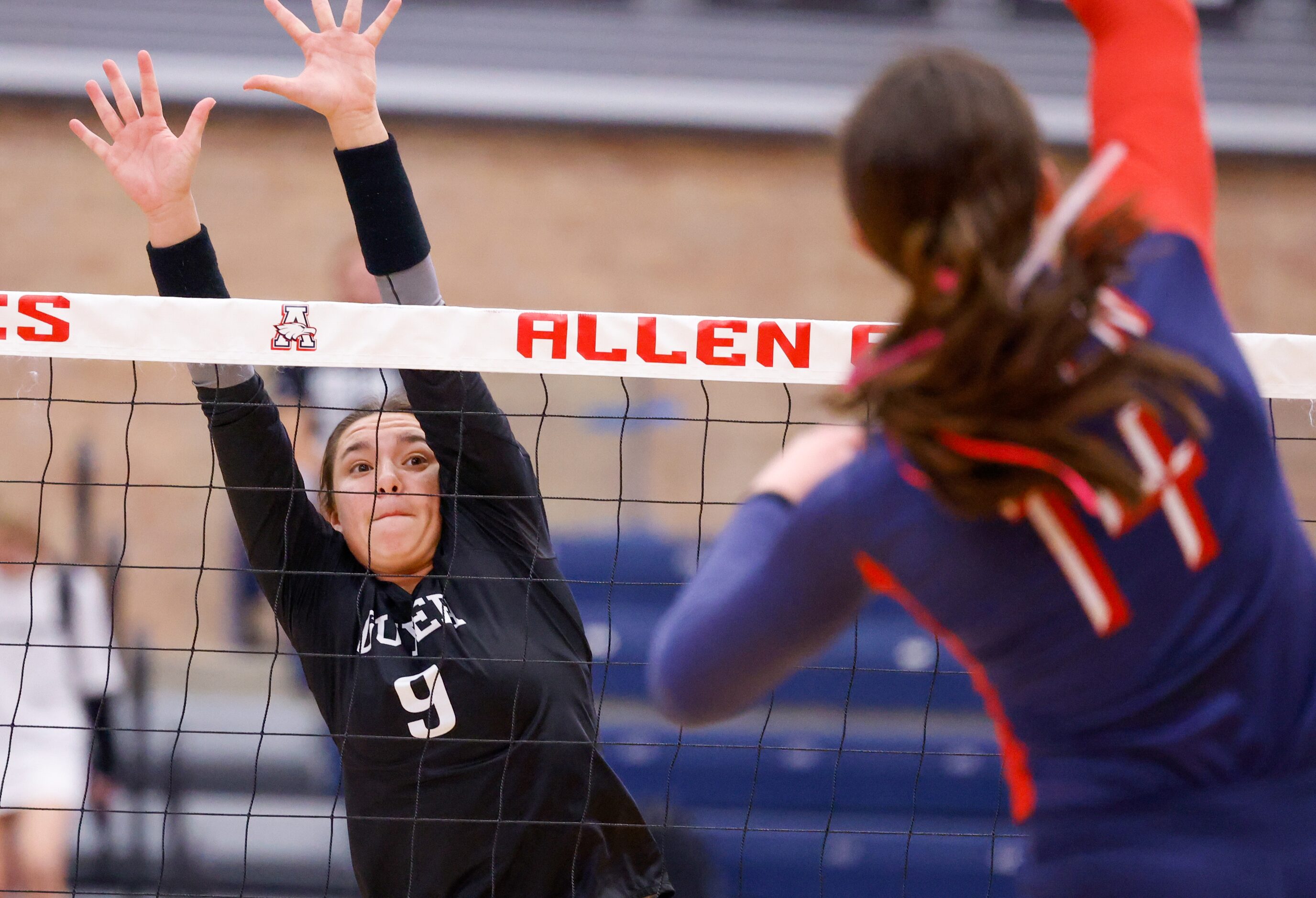 Denton Guyer  senior Lauren Schneider (9) reaches over the net for a block against Allen...