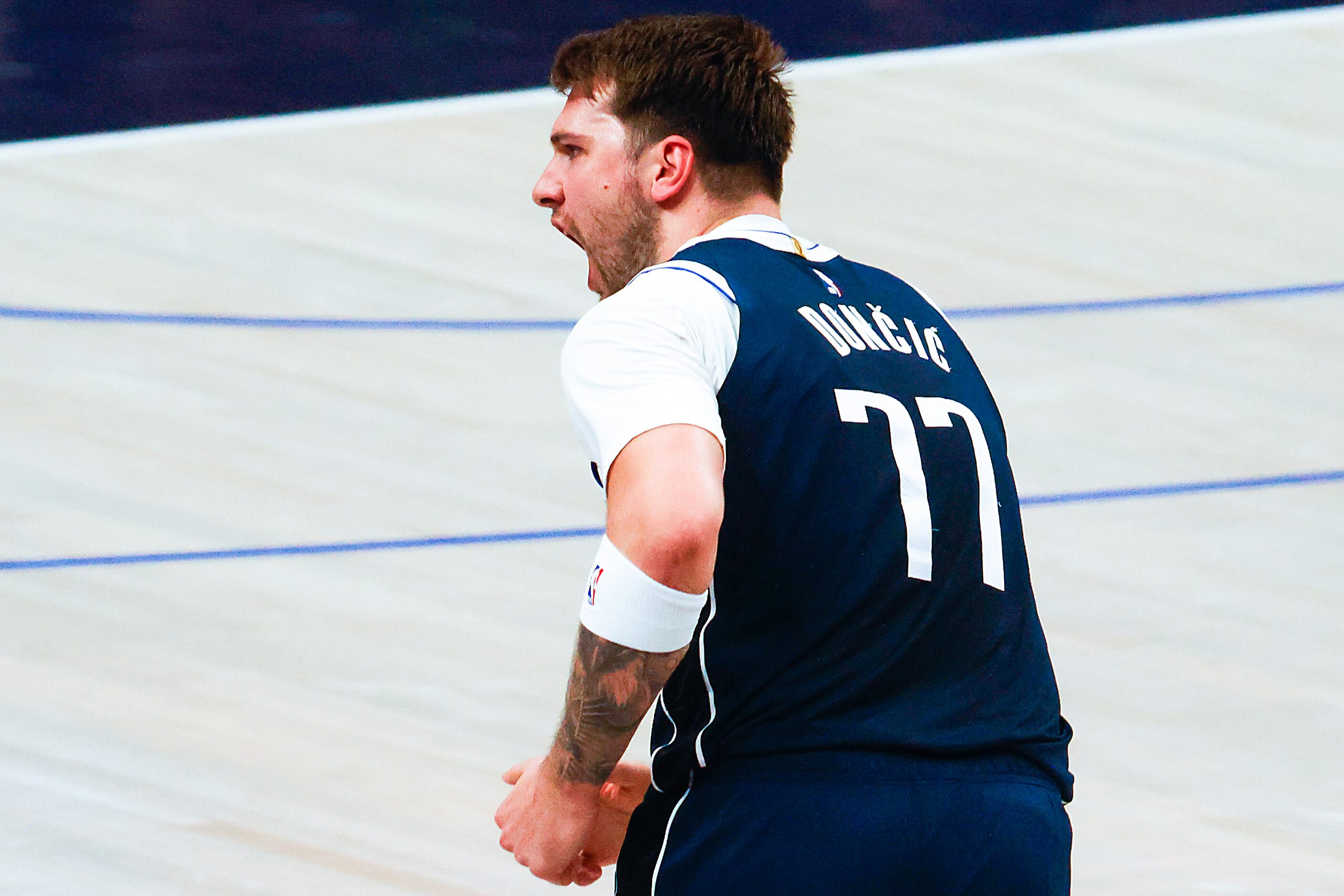 Dallas Mavericks guard Luka Doncic reacts after hitting a three-pointer against the LA...