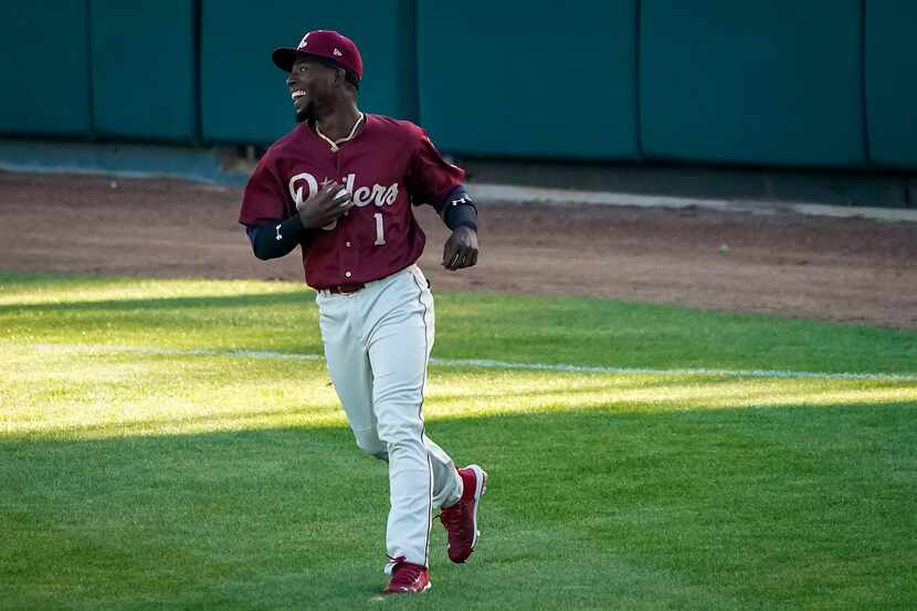 Frisco RoughRiders outfielder J.P. Martinez warms up before facing the Midland RockHounds in...