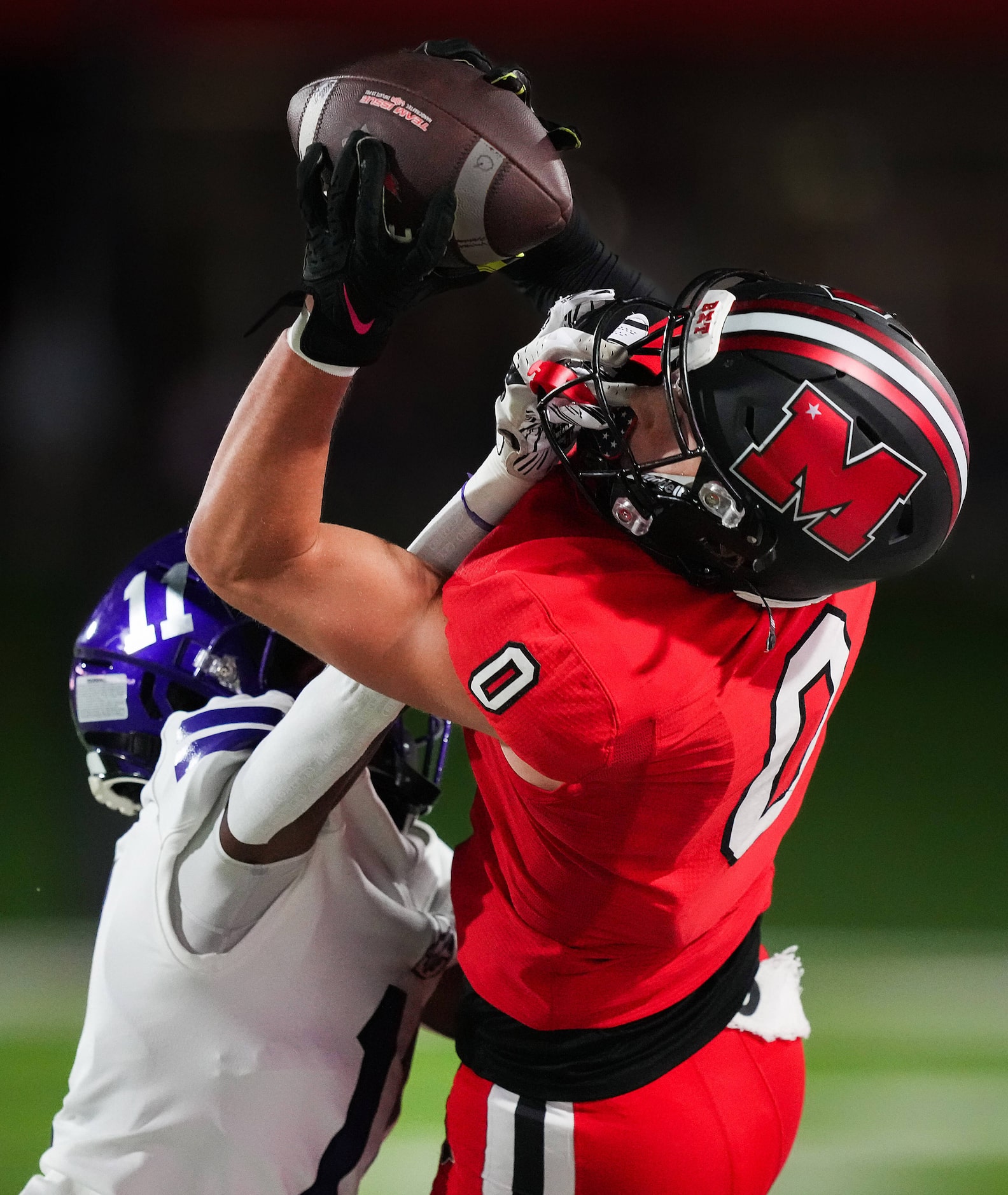 Melissa wide receiver Brett Pool (0) catches a pass as Anna’s Israel Johnson (11) grabs his...