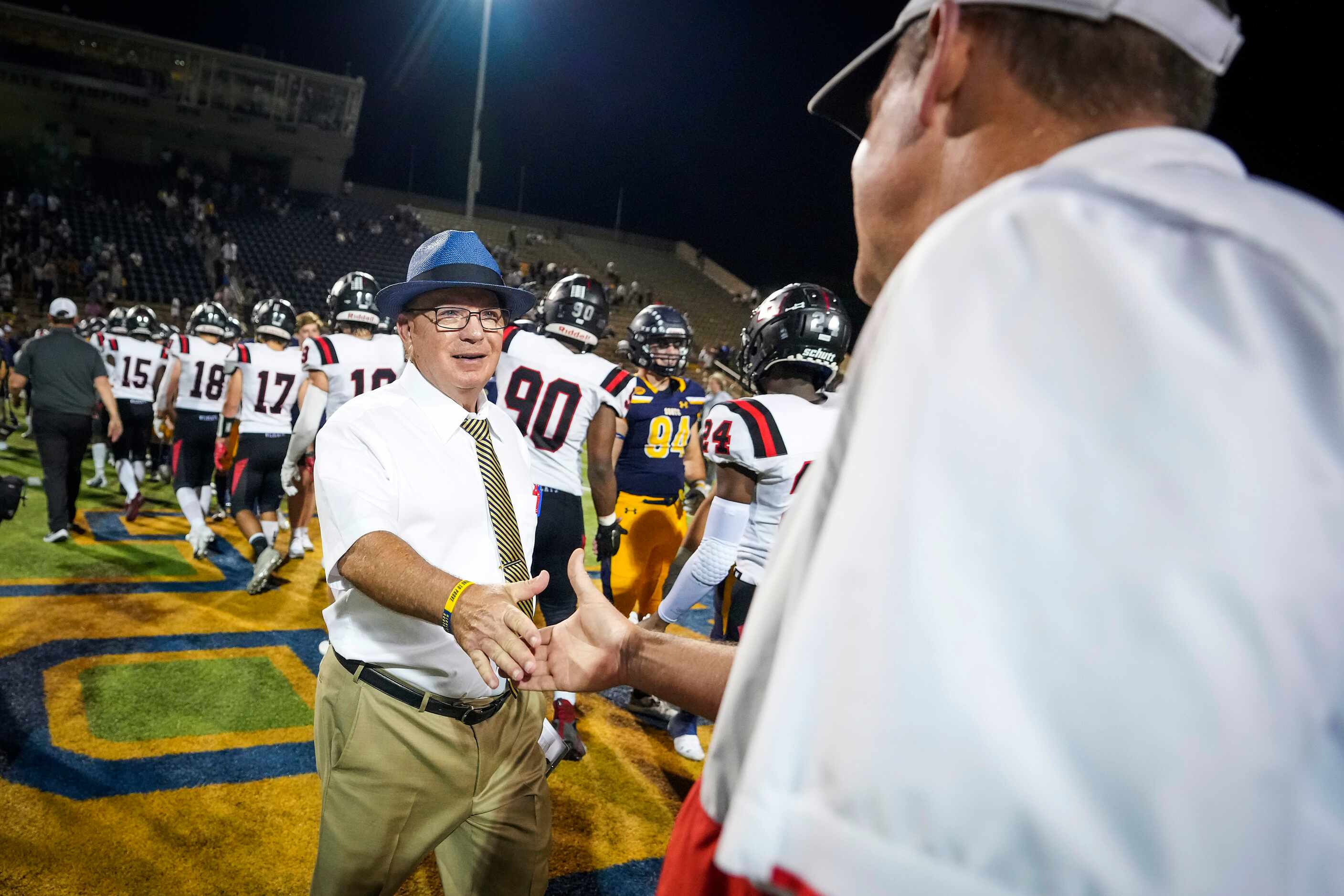 Highland Park head coach Randy Allen shakes hands with Lake Highlands after a high school...