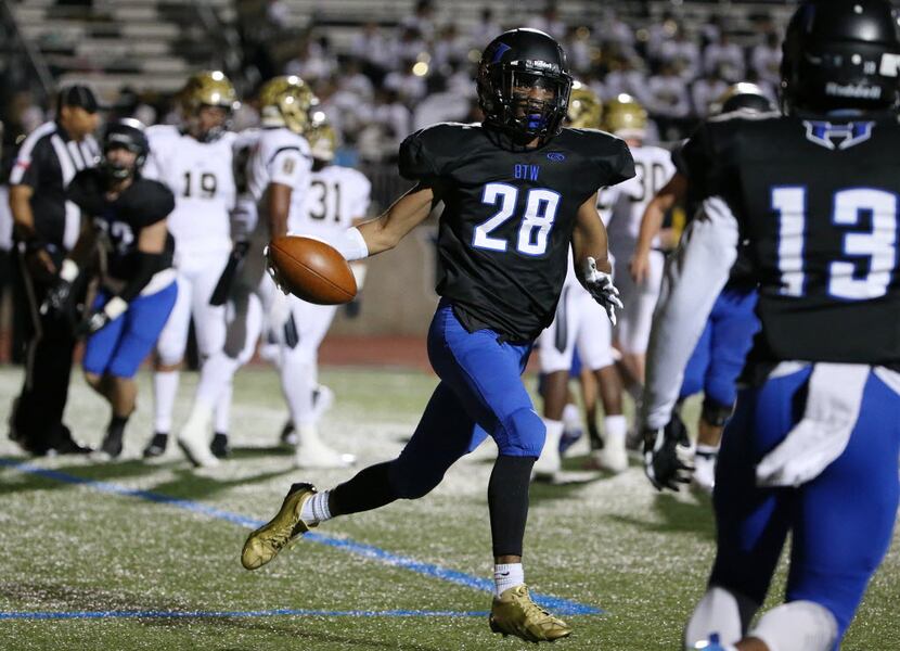 Hebron running back Derian Vaughn (28) celebrates after rushing for a touchdown to make the...