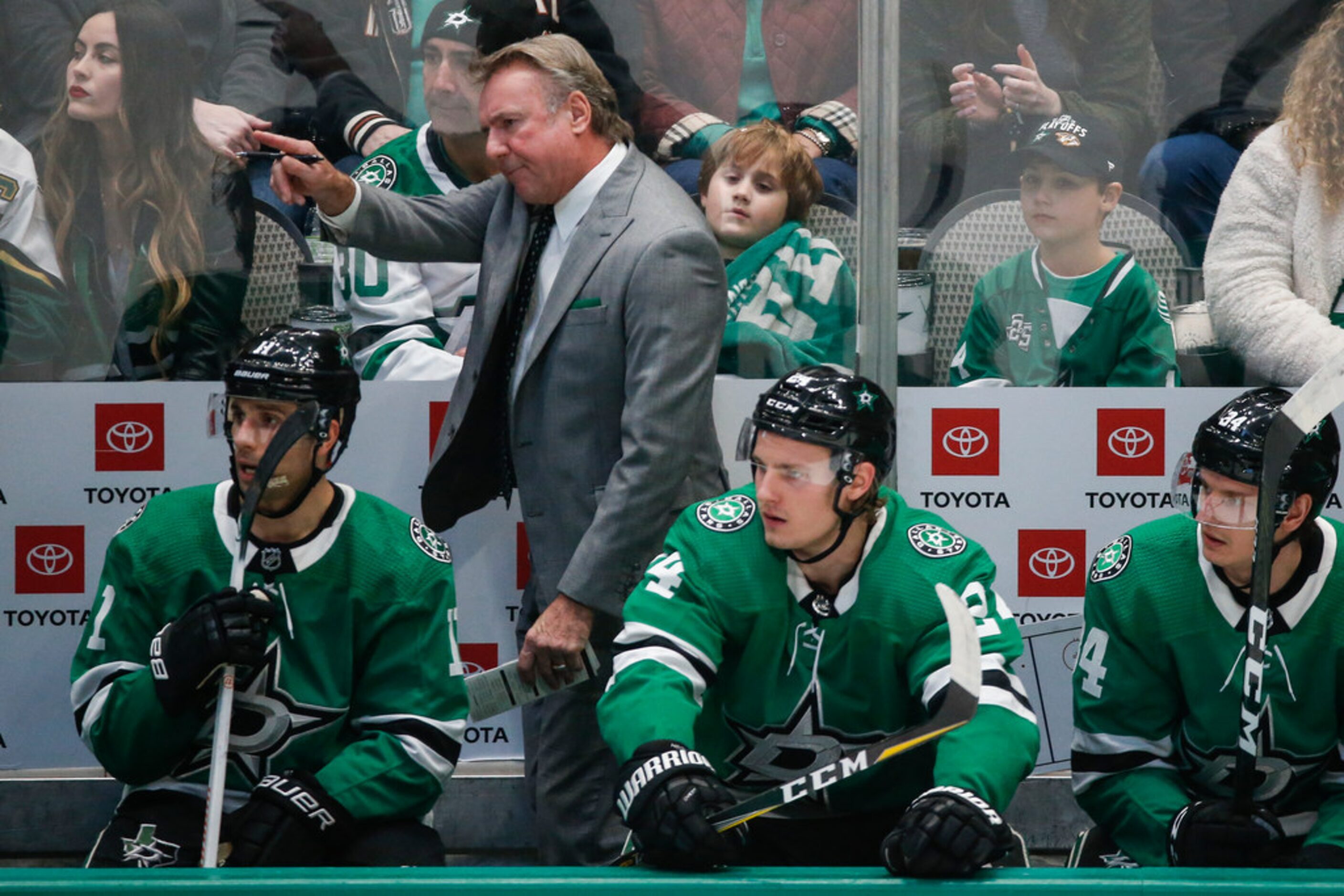 Dallas Stars interim head coach Rick Bowness works the bench during the first period of a...