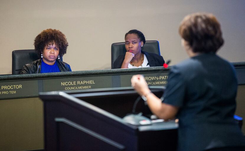 From left, DeSoto City Council members Nicole Raphiel and Kay Brown-Patrick listen to...
