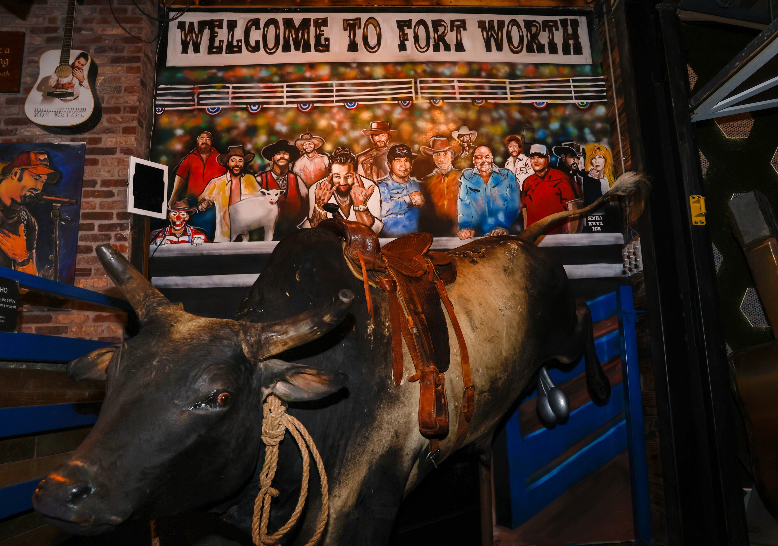 Koe Wetzel (center) is featured on the wall of his namesake Koe Wetzel’s Riot Room in Fort...