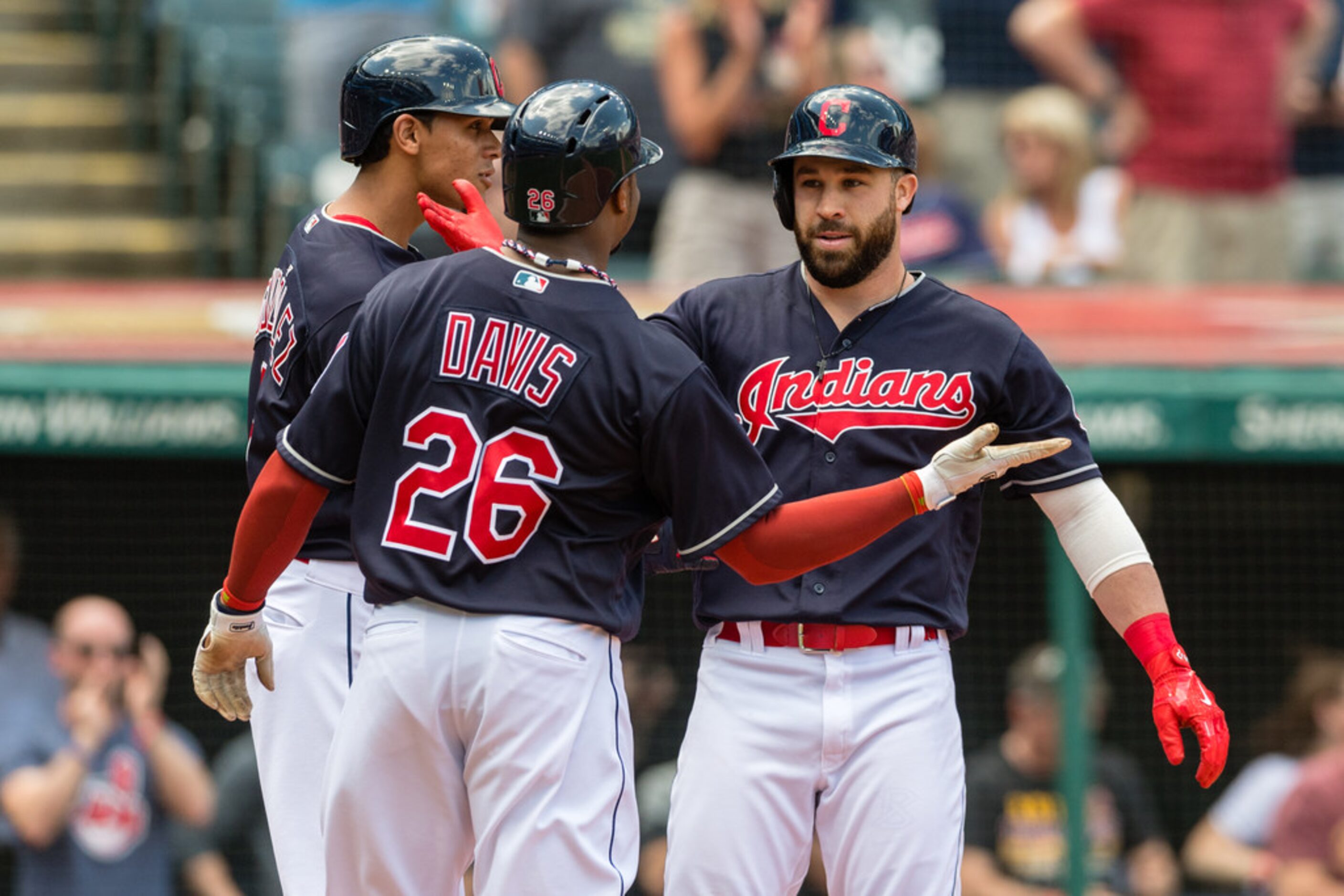 CLEVELAND, OH - MAY 2: Erik Gonzalez #9 and Rajai Davis #26 celebrate with Jason Kipnis #22...