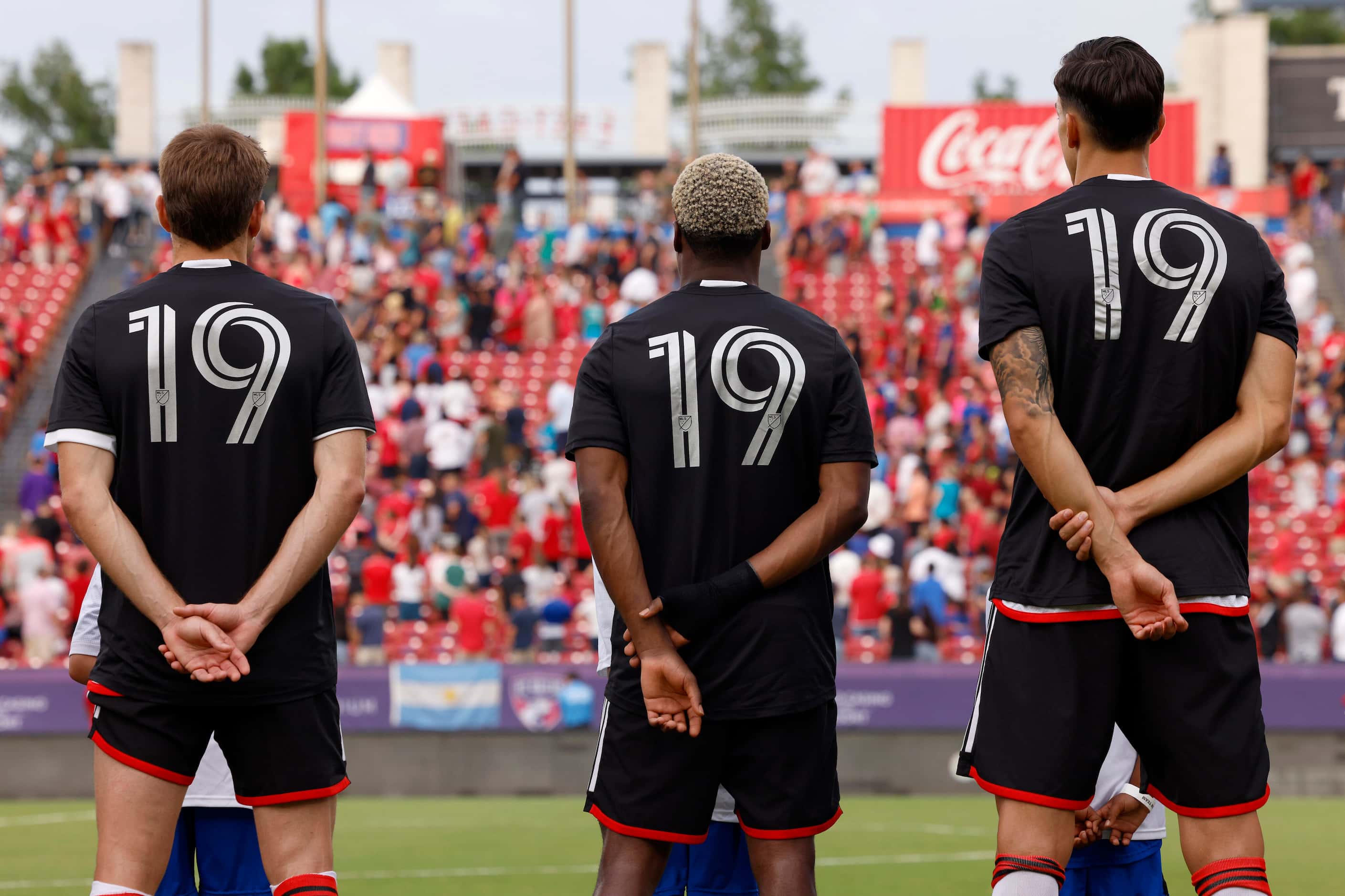 FC Dallas players stand for the Black National Anthem wearing a warm-up jersey celebrating...