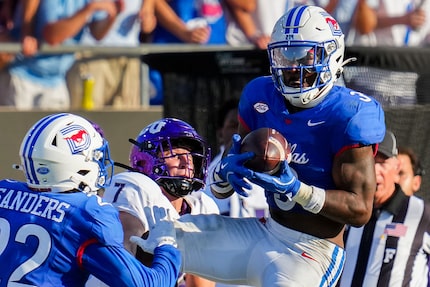 SMU safety Ahmaad Moses (3) intercepts a pass intended for TCU wide receiver JP Richardson...