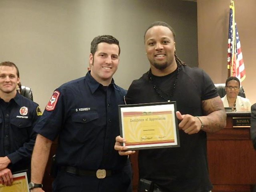 
Wendell Williams (right) presented firefighter and paramedic Daniel Kennedy (left) and the...