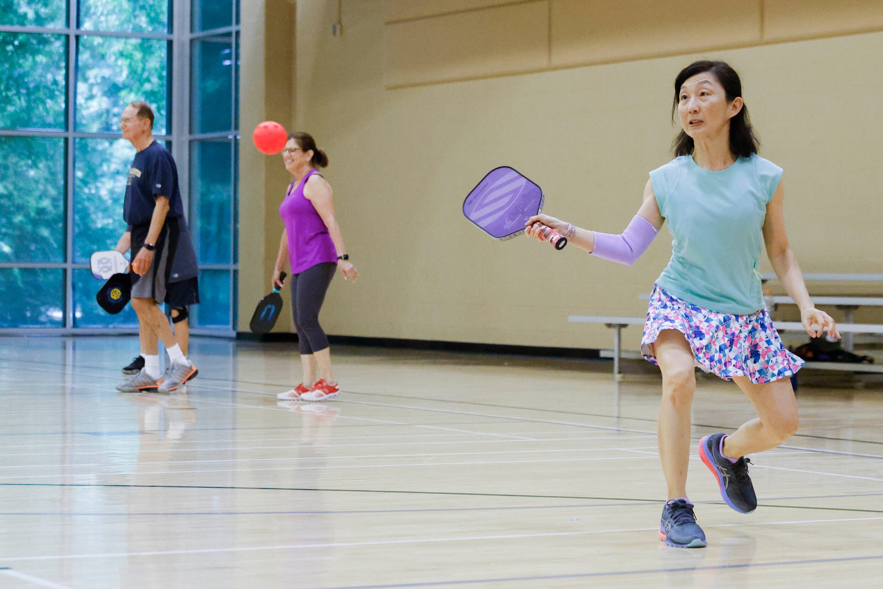 Elaine Tan of Plano hits during a pickle ball game on Friday, May 26, 2023 at Tom...