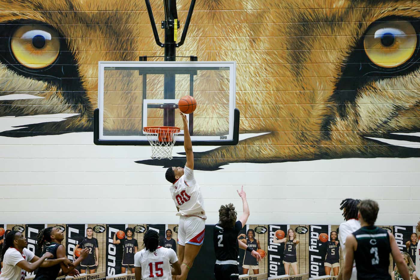 Carter post Daniel Thomas (00) blocks a shot attempt from Canton's Cason Bell (2) during the...