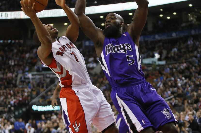 Sacramento Kings forward Quincy Acy (5) defends against Toronto Raptors guard Kyle Lowry (7)...