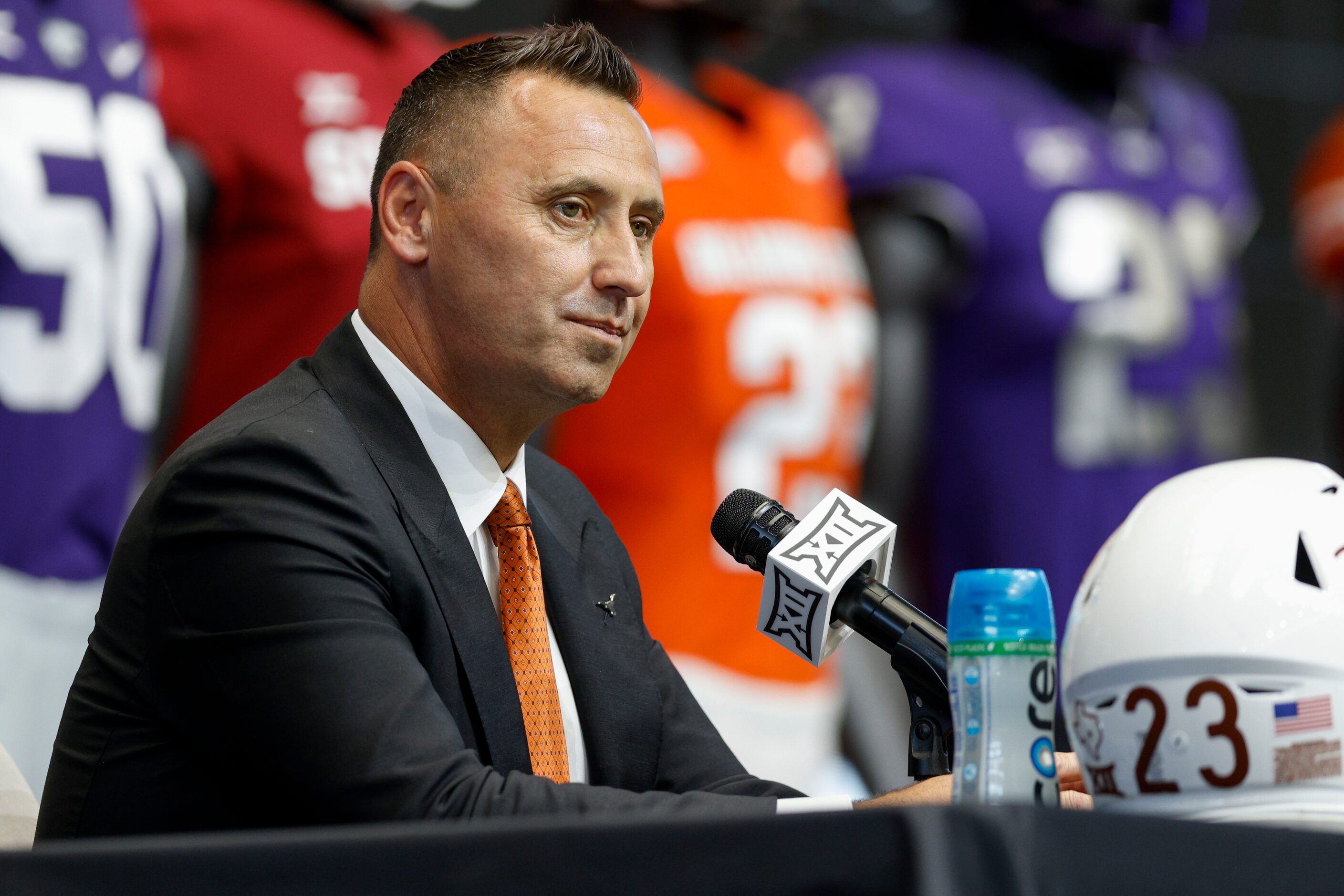 Texas head coach Steve Sarkisian listens to a question during the Big 12 Media Days at AT&T...