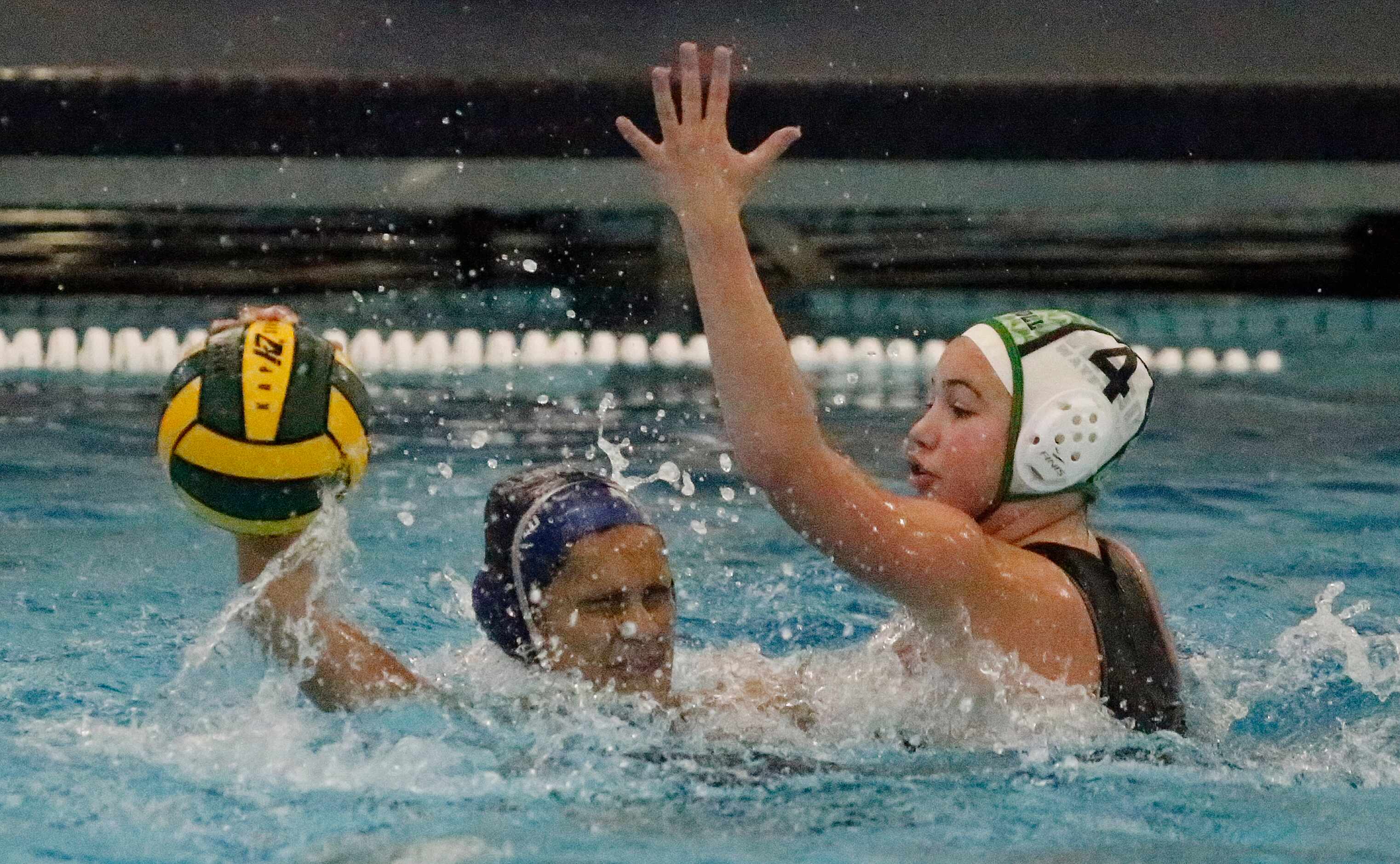 Flower Mound’s Reva Hoshi (6) is defended by Southlake’s Maile Farden (4) during the first...