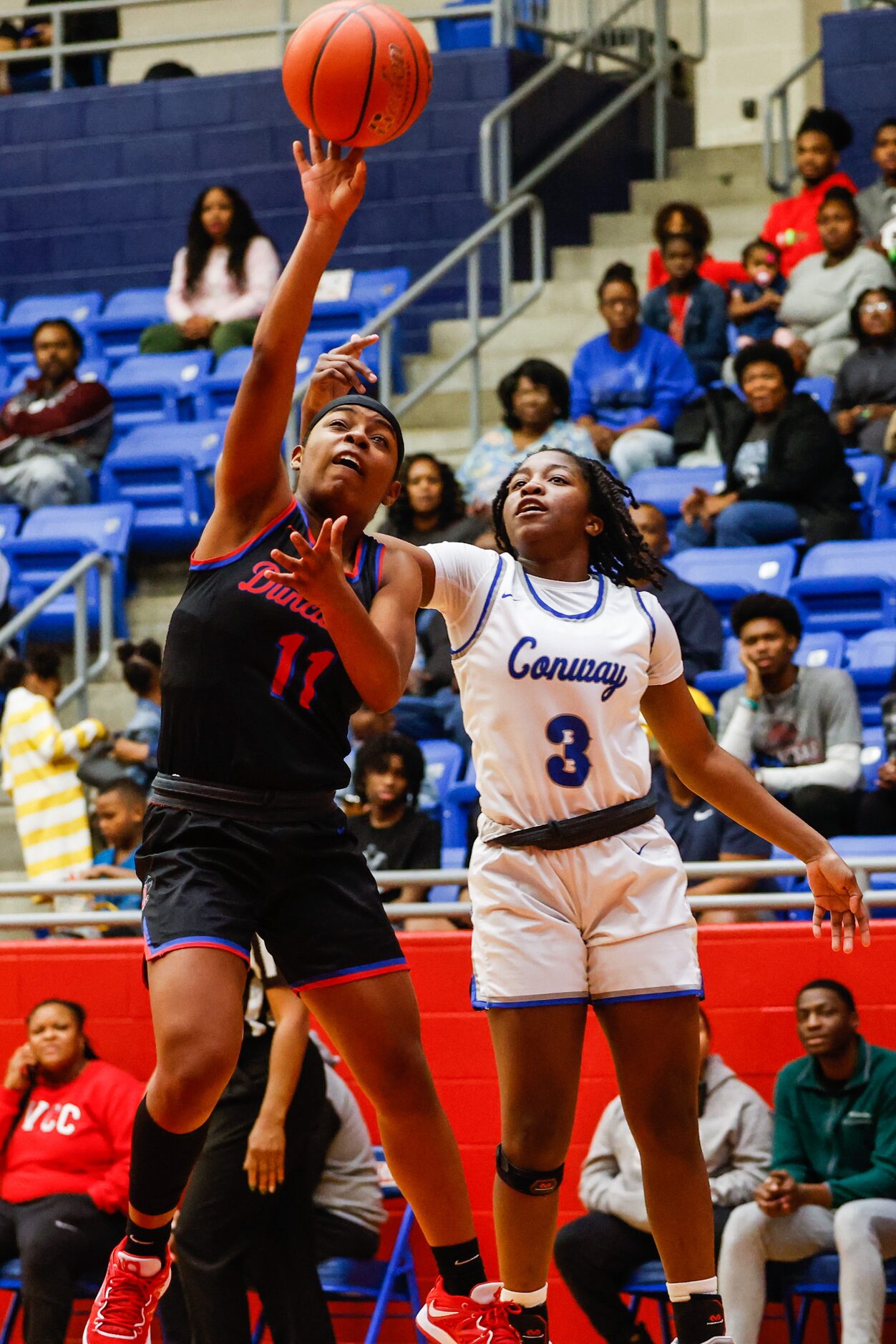 Duncanville Pantherettes' Tristen Taylor (11) goes for a shot against Conway Lady Cats'...