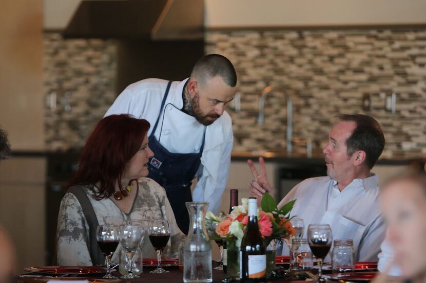 Chef Justin Box chats with guests at his summer pop up dinner Summer Shenanigans at 3015 in...