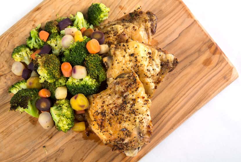 Oven baked chicken thighs with roasted carrots and broccoli 
