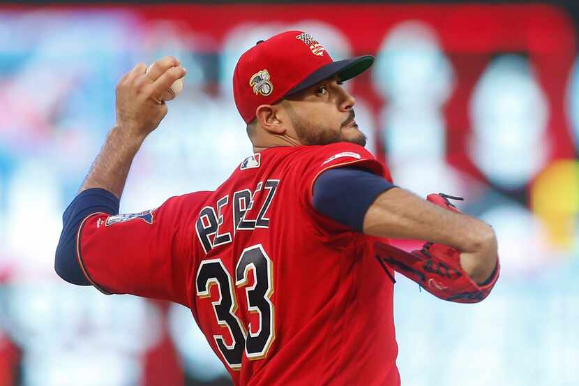 Minnesota Twins pitcher Martin Perez throws to a Texas Rangers batter during the first...
