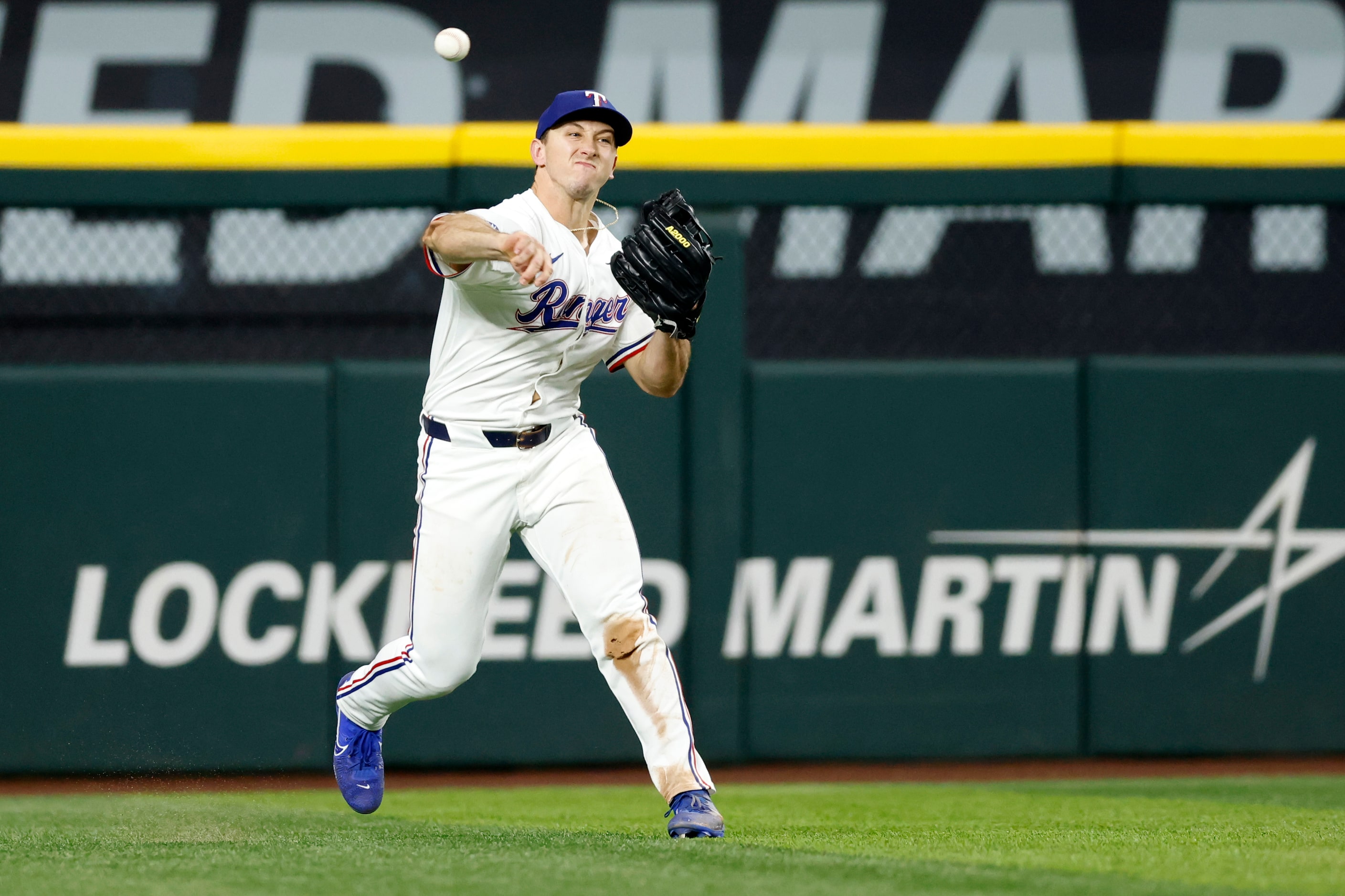 Texas Rangers left fielder Wyatt Langford (36) fields a single by Seattle Mariners center...