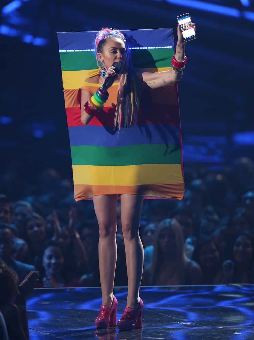 Host Miley Cyrus speaks at the MTV Video Music Awards at the Microsoft Theater on Sunday,...