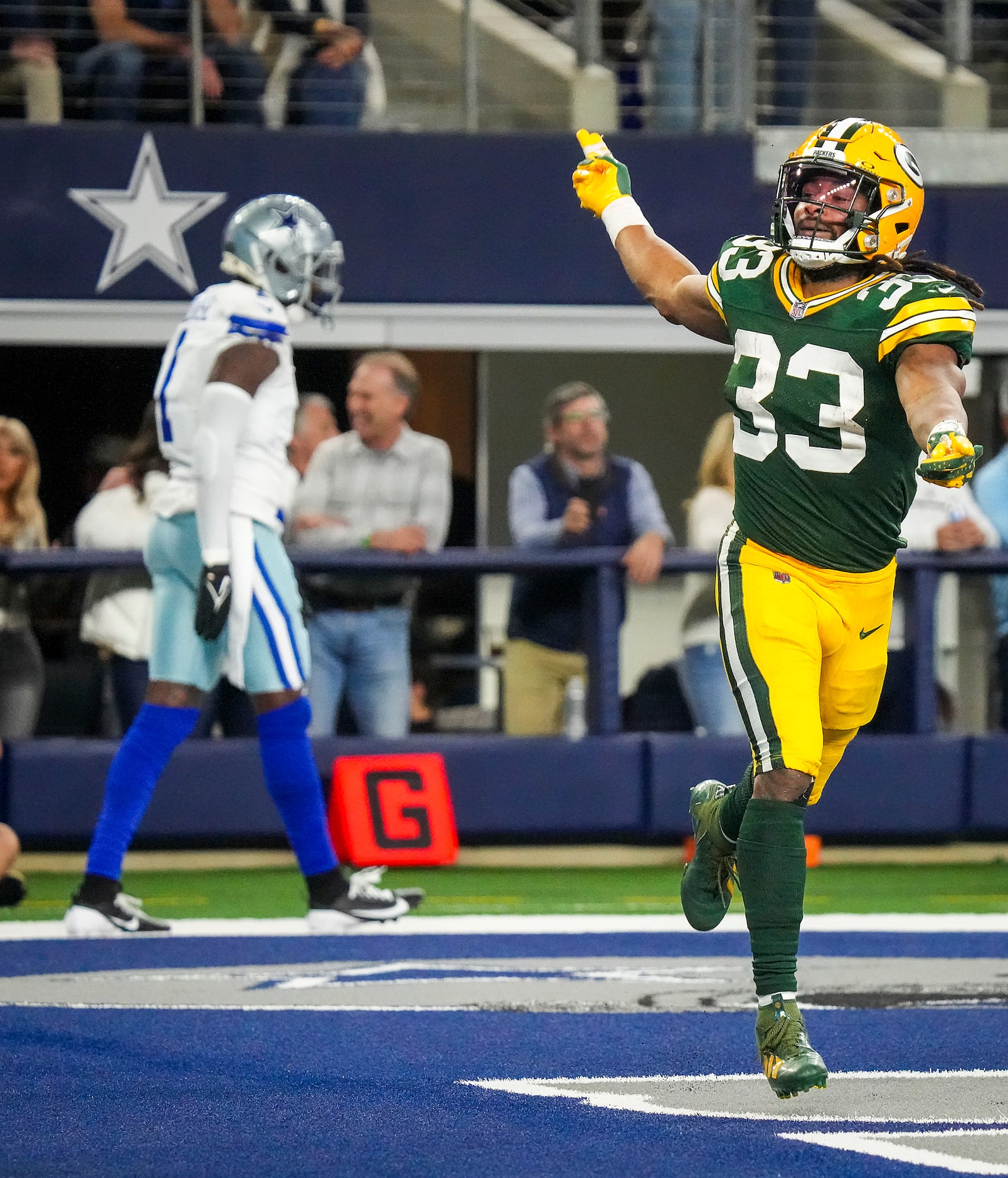 Green Bay Packers running back Aaron Jones (33) celebrates after a touchdown  by Packers...