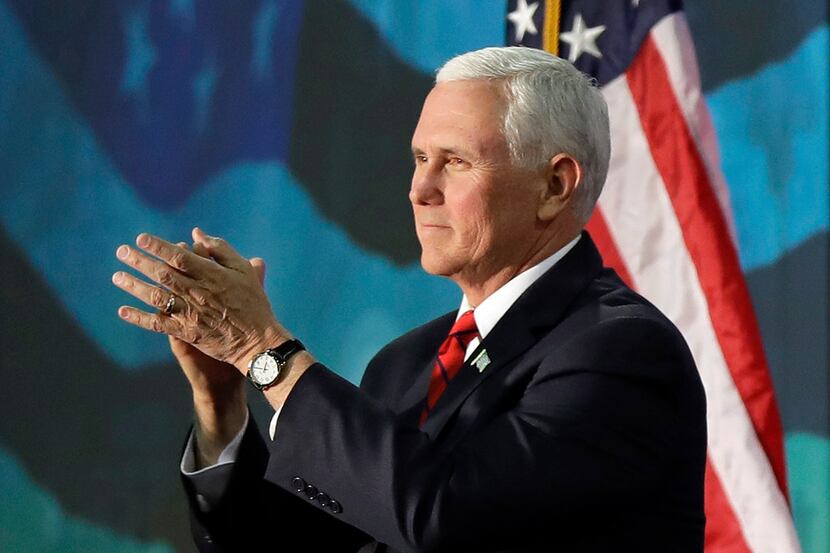 Vice President Mike Pence applauds to the crowd after speaking at an event on tax policy in...