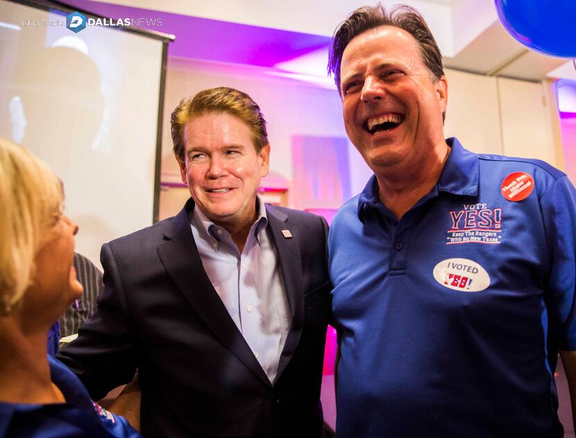 Arlington Mayor Jeff Williams (center) celebrated with Michael Jacobson (right) of the...