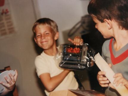 Brad Hunstable holds up a digital clock radio he got for his 8th birthday in 1986. Brad...