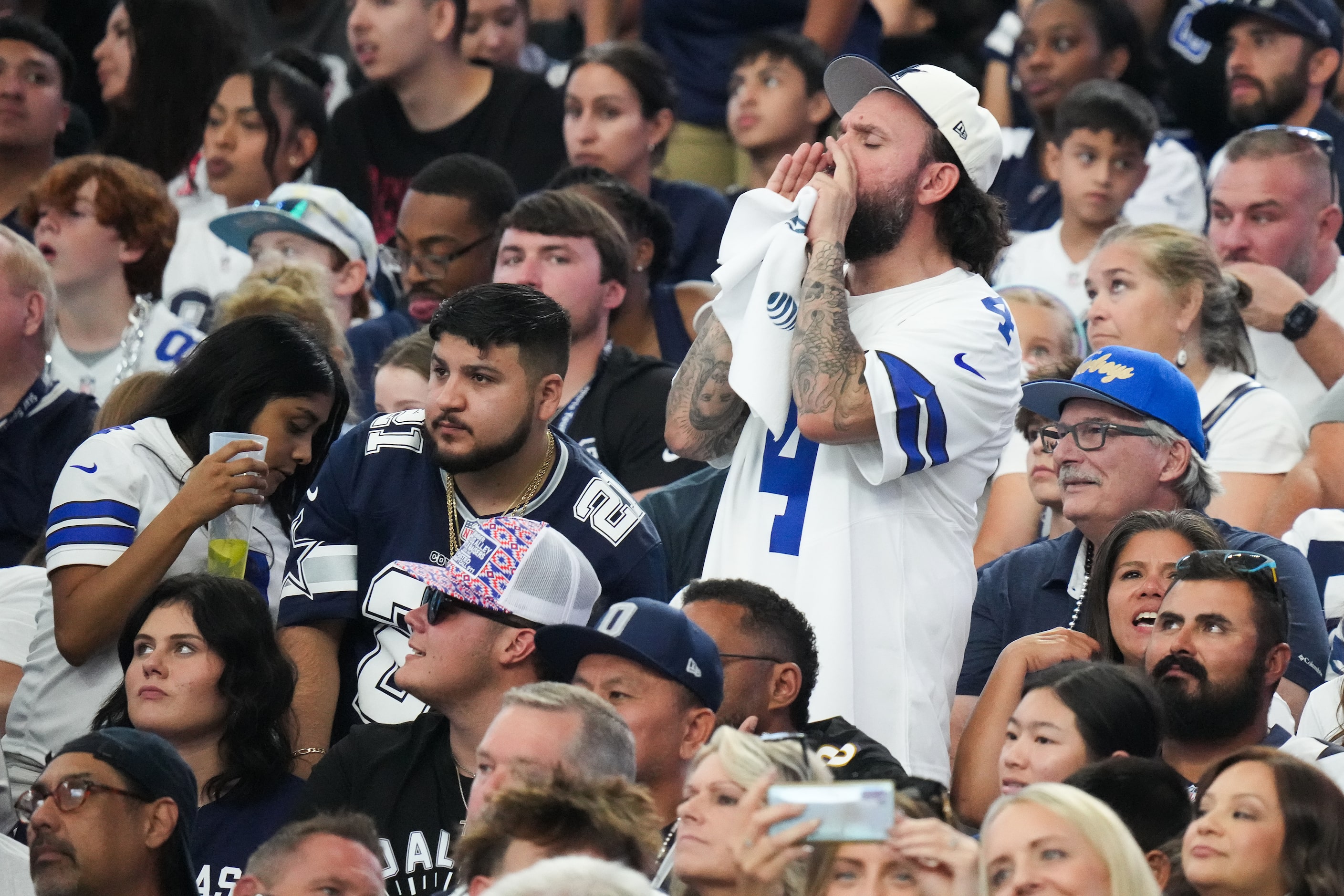 Dallas Cowboys fans boo their offense as the punt team comes on during the first half an NFL...